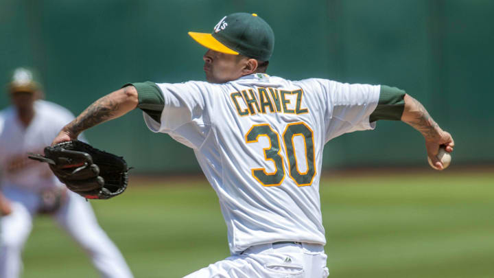 Aug 19, 2015; Oakland, CA, USA; Oakland Athletics starting pitcher Jesse Chavez (30) throws a pitch against the Los Angeles Dodgers during the second inning at O.co Coliseum. Mandatory Credit: Ed Szczepanski-Imagn Images