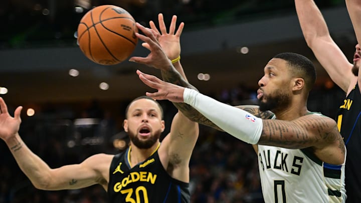 Feb 10, 2025; Milwaukee, Wisconsin, USA: Milwaukee Bucks guard Damian Lillard (0) passes the ball away from Golden State Warriors guard Stephen Curry (30) in the fourth quarter at Fiserv Forum. Mandatory Credit: Benny Sieu-Imagn Images Feb 10, 2025; Milwaukee, Wisconsin, USA: Milwaukee Bucks guard Damian Lillard (0) passes the ball away from Golden State Warriors guard Stephen Curry (30) in the fourth quarter at Fiserv Forum. Mandatory Credit: Benny Sieu-Imagn Images
