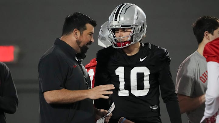 Mar 7, 2024; Columbus, OH, USA; Ohio State Buckeyes head coach Ryan Day talks to quarterback Julian Sayin (10) during spring football practice at the Woody Hayes Athletic Center.