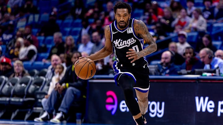 Feb 13, 2025; New Orleans, Louisiana, USA;  Sacramento Kings guard Malik Monk (0) brings the ball up court against the New Orleans Pelicans during the first half at Smoothie King Center. Mandatory Credit: Stephen Lew-Imagn Images