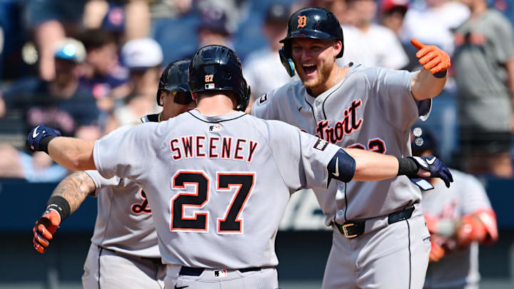 Jul 6, 2025; Cleveland, Ohio, USA; Detroit Tigers shortstop Trey Sweeney (27) celebrates with Javier Baez third baseman (28) and center fielder Parker Meadows (22) after hitting a home run during the tenth inning against the Cleveland Guardians at Progressive Field. Mandatory Credit: Ken Blaze-Imagn Images