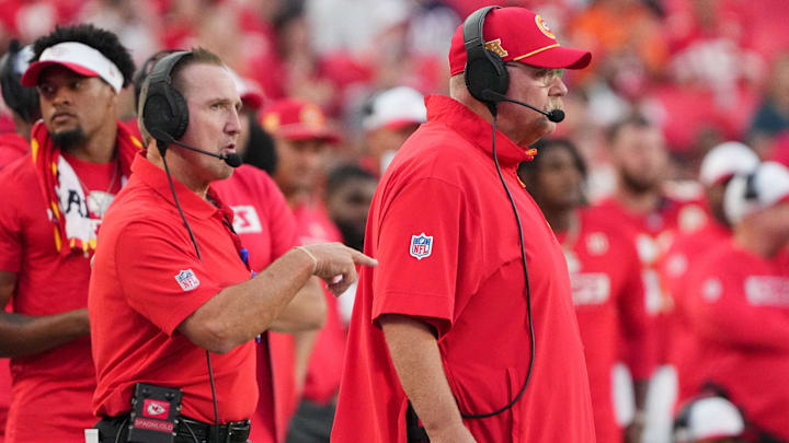 Aug 22, 2024; Kansas City, Missouri, USA; Kansas City Chiefs defensive coordinator Steve Spagnuolo, left and head coach Andy Reid watch play against the Chicago Bears during the game at GEHA Field at Arrowhead Stadium. Mandatory Credit: Denny Medley-Imagn Images
