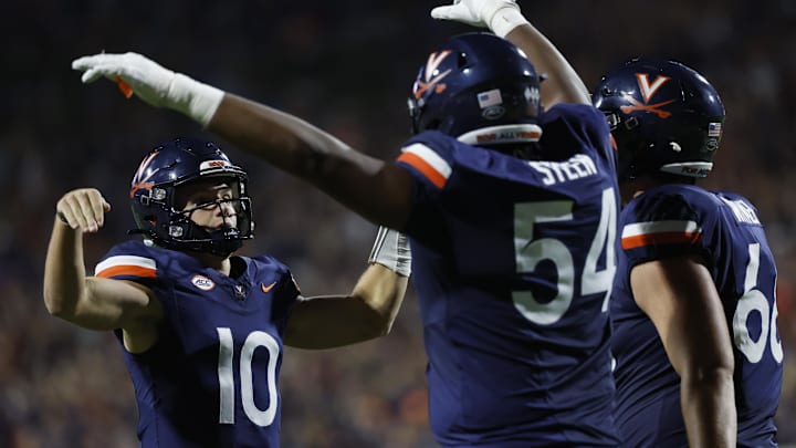 Sep 14, 2024; Charlottesville, Virginia, USA; Virginia Cavaliers quarterback Anthony Colandrea (10) celebrates with Cavaliers offensive lineman Blake Steen (54) after scoring a touchdown against the Maryland Terrapins during the first half at Scott Stadium. Mandatory Credit: Geoff Burke-Imagn Images