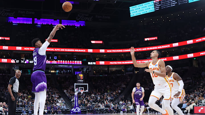 Nov 13, 2025; Salt Lake City, Utah, USA; Utah Jazz guard Ace Bailey (19) takes a three point shot against Atlanta Hawks forward Zaccharie Risacher (10) during the second half at Delta Center. Mandatory Credit: Rob Gray-Imagn Images