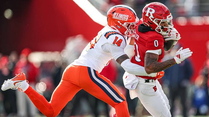 Nov 23, 2024; Piscataway, New Jersey, USA; Rutgers Scarlet Knights wide receiver Dymere Miller (0) is tackled by Illinois Fighting Illini defensive back Xavier Scott (14) during the first half at SHI Stadium. Mandatory Credit: Vincent Carchietta-Imagn Images Nov 23, 2024; Piscataway, New Jersey, USA; Rutgers Scarlet Knights wide receiver Dymere Miller (0) is tackled by Illinois Fighting Illini defensive back Xavier Scott (14) during the first half at SHI Stadium. Mandatory Credit: Vincent Carchietta-Imagn Images