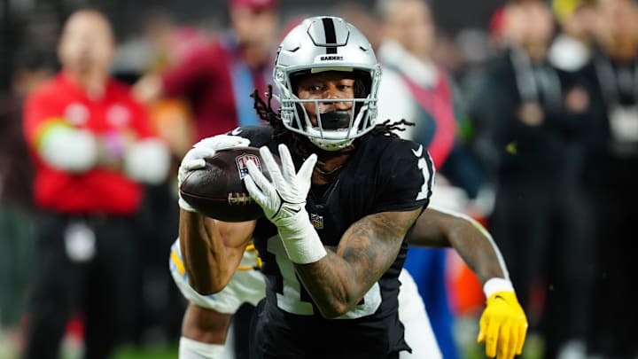 Dec 14, 2023; Paradise, Nevada, USA;  Las Vegas Raiders wide receiver Jakobi Meyers (16) makes a catch for a touchdown against the Los Angeles Chargers in the first quarter at Allegiant Stadium.