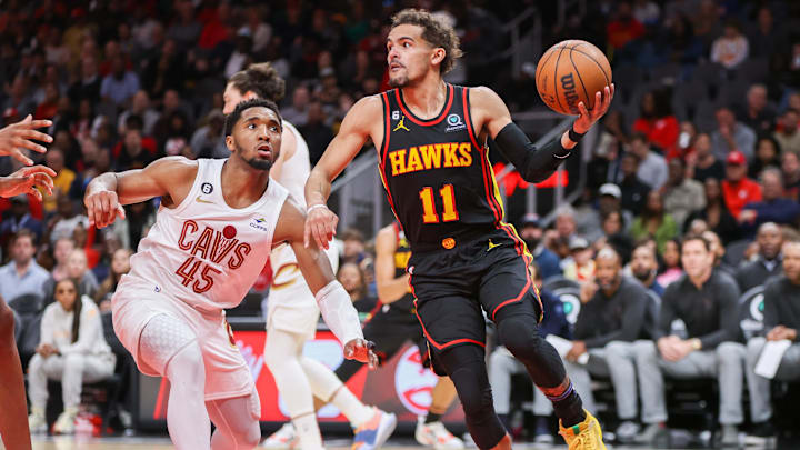 Mar 28, 2023; Atlanta, Georgia, USA; Atlanta Hawks guard Trae Young (11) passes around Cleveland Cavaliers guard Donovan Mitchell (45) in the second half at State Farm Arena. Mandatory Credit: Brett Davis-USA TODAY Sports
Mar 28, 2023; Atlanta, Georgia, USA; Atlanta Hawks guard Trae Young (11) passes around Cleveland Cavaliers guard Donovan Mitchell (45) in the second half at State Farm Arena. Mandatory Credit: Brett Davis-USA TODAY Sports