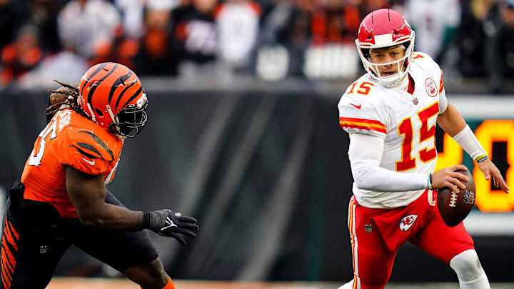 Kansas City Chiefs quarterback Patrick Mahomes (15) is chased out of the pocket by Cincinnati