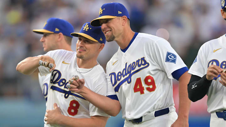 Mar 27, 2026; Los Angeles, California, USA; Los Angeles Dodgers first baseman Enrique Hernández (8) and pitcher Blake Treinen (49) pose with their rings during the World Series ring ceremony before the game against the Arizona Diamondbacks at Dodger Stadium. Mandatory Credit: Jayne Kamin-Oncea-Imagn Images