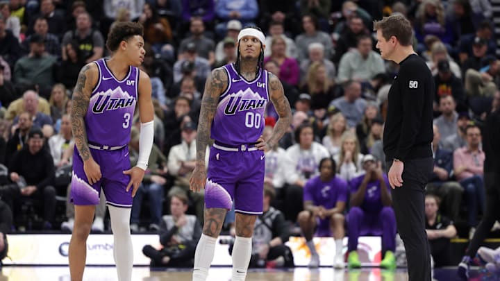 Jan 18, 2024; Salt Lake City, Utah, USA;  Utah Jazz guard Keyonte George (3) and guard Jordan Clarkson (00) and head coach Will Hardy talk during a stop in play during the second half against the Oklahoma City Thunder at Delta Center. Mandatory Credit: Chris Nicoll-Imagn Images