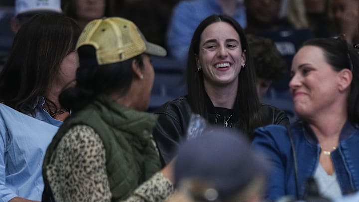 Indiana Fever Caitlin Clark smiles while talking to Butler Bulldogs fans on Monday, Nov. 4, 2024, during the game at Hinkle Fieldhouse in Indianapolis. The Butler Bulldogs defeated the Missouri State Bears, 72-65. Indiana Fever Caitlin Clark smiles while talking to Butler Bulldogs fans on Monday, Nov. 4, 2024, during the game at Hinkle Fieldhouse in Indianapolis. The Butler Bulldogs defeated the Missouri State Bears, 72-65.
