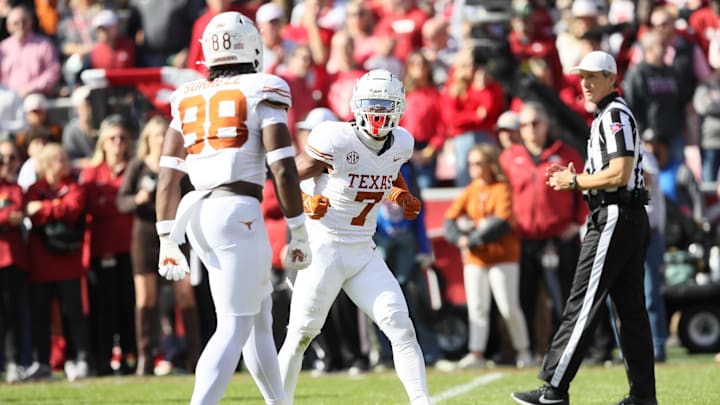 Nov 16, 2024; Fayetteville, Arkansas, USA; Texas Longhorns defensive back Jahdae Barron (7) celebrates after making a play against the Arkansas Razorbacks during the first quarter at Donald W. Reynolds Razorback Stadium. Mandatory Credit: Nelson Chenault-Imagn Images