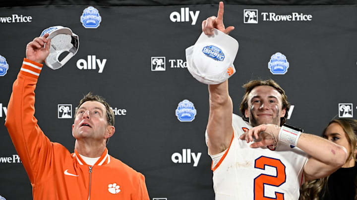 Dec 7, 2024; Charlotte, NC, USA; Clemson Tigers head coach Dabo Swinney, and quarterback Cade Klubnik (2) celebrate after winning the 2024 ACC Championship game against the Southern Methodist Mustangs at Bank of America Stadium. 