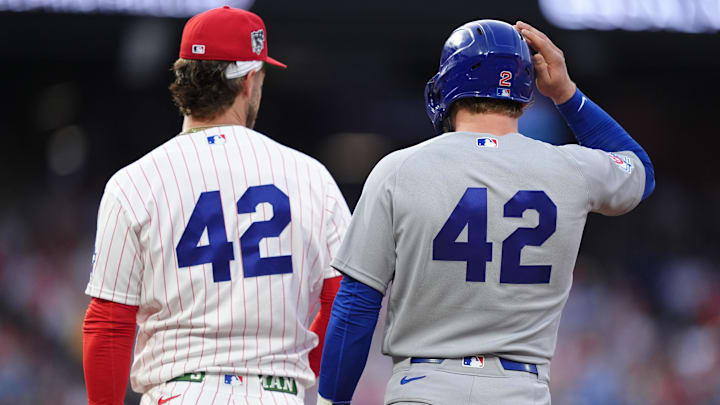 Apr 15, 2026; Philadelphia, Pennsylvania, USA; Chicago Cubs infielder Nico Hoerner (42) stands with Philadelphia Phillies infielder Bryce Harper (42) on first in the third inning at Citizens Bank Park.