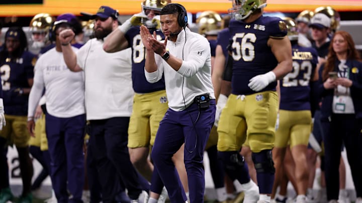 Jan 20, 2025; Atlanta, GA, USA; Notre Dame Fighting Irish head coach Marcus Freeman reacts after a play against the Ohio State Buckeyes during the second half the CFP National Championship college football game at Mercedes-Benz Stadium. Mandatory Credit: Brett Davis-Imagn Images