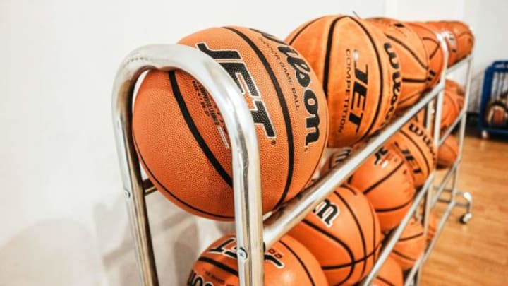 A Simi Valley man who worked as an assistant basketball coach at a local high school has been charged with committing lewd acts involving two teenage girls.