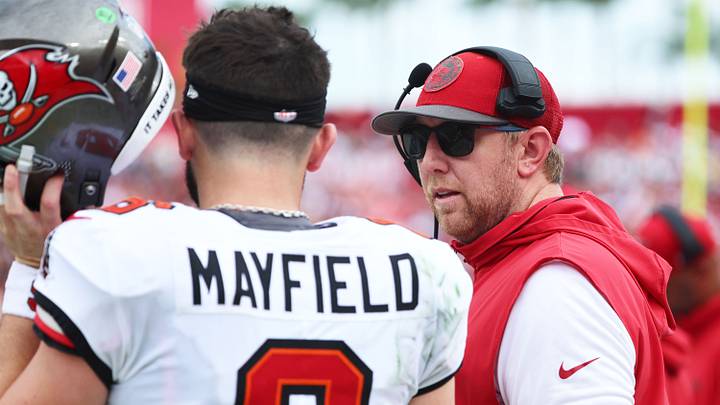 Sep 8, 2024; Tampa, Florida, USA; Tampa Bay Buccaneers quarterback Baker Mayfield (6) talks with offensive coordinator Liam Coen against the Washington Commanders during the first half at Raymond James Stadium. Mandatory Credit: Kim Klement Neitzel-Imagn Images Sep 8, 2024; Tampa, Florida, USA; Tampa Bay Buccaneers quarterback Baker Mayfield (6) talks with offensive coordinator Liam Coen against the Washington Commanders during the first half at Raymond James Stadium. Mandatory Credit: Kim Klement Neitzel-Imagn Images