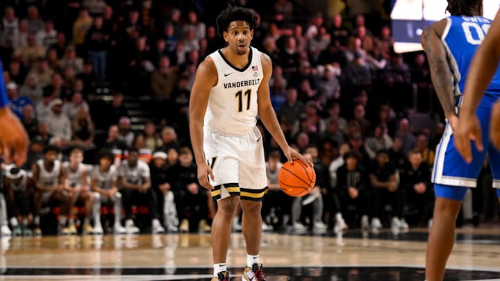 Jan 25, 2025; Nashville, Tennessee, USA;  Vanderbilt Commodores guard AJ Hoggard (11) dribbles the ball against the Kentucky Wildcats during the first half at Memorial Gymnasium. Mandatory Credit: Steve Roberts-Imagn Images