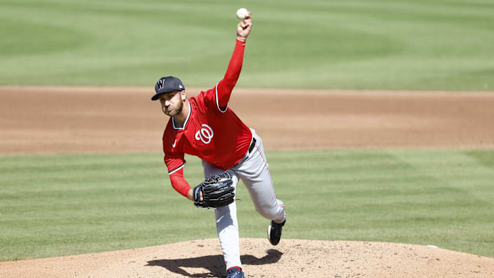 Feb 25, 2025; Jupiter, Florida, USA;  Washington Nationals relief pitcher Colin Poche (41) throws against the Miami Marlins during the fourth inning at Roger Dean Chevrolet Stadium. 