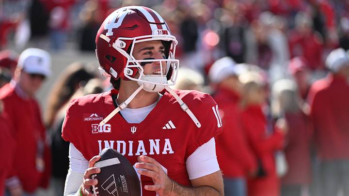 Oct 17, 2026; Bloomington, Indiana, USA;  Indiana Hoosiers quarterback Josh Hoover (10) warms up before the game against the Ohio State Buckeyes at Merchants Bank Field at Memorial Stadium.  Mandatory Credit: Robert Goddin-Imagn Images