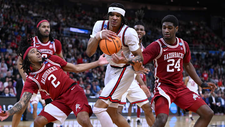 Mar 22, 2025; Providence, RI, USA: Arkansas Razorbacks guard Boogie Fland (2) and forward Billy Richmond III (24) fight for a rebound against St. John's Red Storm guard Aaron Scott (0) during the second half of a second round men’s NCAA Tournament game at Amica Mutual Pavilion. Mandatory Credit: Brian Fluharty-Imagn Images Mar 22, 2025; Providence, RI, USA: Arkansas Razorbacks guard Boogie Fland (2) and forward Billy Richmond III (24) fight for a rebound against St. John's Red Storm guard Aaron Scott (0) during the second half of a second round men’s NCAA Tournament game at Amica Mutual Pavilion. Mandatory Credit: Brian Fluharty-Imagn Images