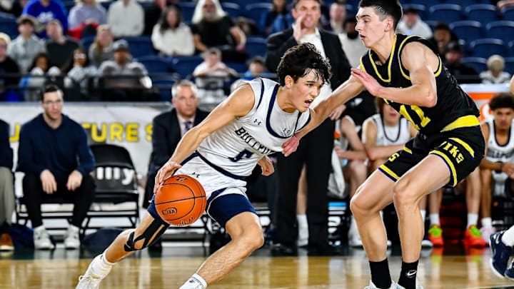 Brogan Howell, left, sank the game-winning shot with two seconds remaining to win the Class 4A boys basketball championship for Gonzaga Prep.