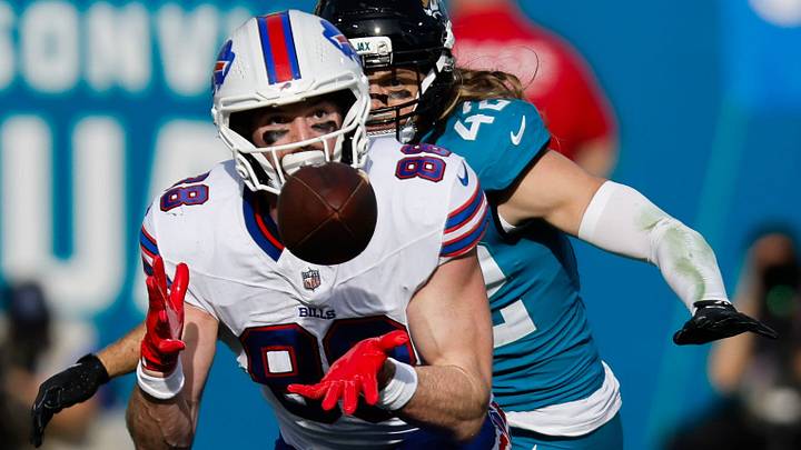 Buffalo Bills tight end Dawson Knox (88). Hauls in a pass under Jacksonville Jaguars safety Andrew Wingard (42) during the fourth quarter in an NFL football AFC Wild Card playoff matchup, Sunday, Jan. 11, 2026, in Jacksonville, Fla. Bills lead 10-7 at the half over the Jaguars. Buffalo Bills tight end Dawson Knox (88). Hauls in a pass under Jacksonville Jaguars safety Andrew Wingard (42) during the fourth quarter in an NFL football AFC Wild Card playoff matchup, Sunday, Jan. 11, 2026, in Jacksonville, Fla. Bills lead 10-7 at the half over the Jaguars.