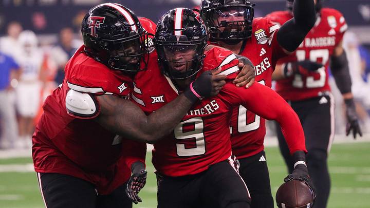 Texas Tech players Lee Hunter (left) and Jacob Rodriguez (back) celebrate Romello Height's fumble recover against BYU during the Big 12 Conference championship football game, Saturday, Nov. 6, 2025, at AT&T Stadium in Arlington. Texas Tech players Lee Hunter (left) and Jacob Rodriguez (back) celebrate Romello Height's fumble recover against BYU during the Big 12 Conference championship football game, Saturday, Nov. 6, 2025, at AT&T Stadium in Arlington.