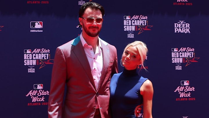 Jul 15, 2025; Atlanta, GA, USA; National League pitcher Paul Skenes (30) of the Pittsburgh Pirates and social media influencer Livvy Dunne pose for a photo on the red carpet before the 2025 MLB All Star Game at Truist Park. 