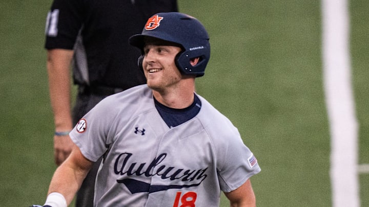 Auburn Tigers catcher Ike Irish (18) runs from third base to home to score a run for the Tigers in the third inning as the Texas Longhorns take on the Auburn in the first game of a three-game series on Thursday night at UFCU Disch-Falk Field in Austin, April 17, 2025.