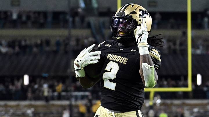 Purdue Boilermakers running back Fame Ijeboi (2) motions after scoring a touchdown.