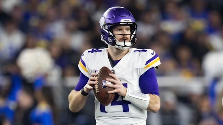 Jan 13, 2025; Glendale, AZ, USA; Minnesota Vikings quarterback Sam Darnold (14) against the Los Angeles Rams during an NFC wild card game at State Farm Stadium. 