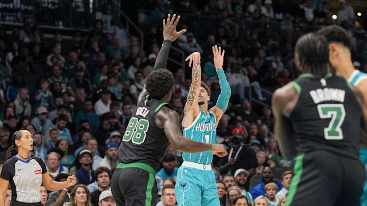 Nov 1, 2024; Charlotte, North Carolina, USA; Charlotte Hornets guard LaMelo Ball (1) shoots over Boston Celtics center Neemias Queta (88) during the second half at the Spectrum Center. Mandatory Credit: Jim Dedmon-Imagn Images