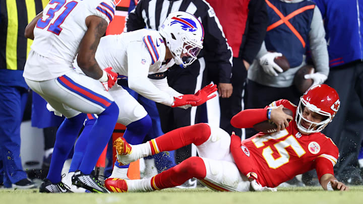 Jan 26, 2025; Kansas City, MO, USA; Kansas City Chiefs quarterback Patrick Mahomes (15) slides for a first down against the Buffalo Bills during the first half in the AFC Championship game at GEHA Field at Arrowhead Stadium. Mandatory Credit: Mark J. Rebilas-Imagn Images