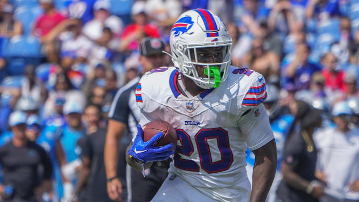 Aug 24, 2024; Orchard Park, New York, USA;  Buffalo Bills running back Frank Gore Jr. (20) runs with the ball for a touchdown against the Carolina Panthers during the second half at Highmark Stadium.