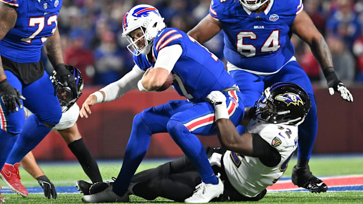 Sep 7, 2025; Orchard Park, New York, USA; Baltimore Ravens defensive tackle Nnamdi Madubuike (92) tackles Buffalo Bills quarterback Josh Allen (17) during the first quarter at Highmark Stadium Sep 7, 2025; Orchard Park, New York, USA; Baltimore Ravens defensive tackle Nnamdi Madubuike (92) tackles Buffalo Bills quarterback Josh Allen (17) during the first quarter at Highmark Stadium