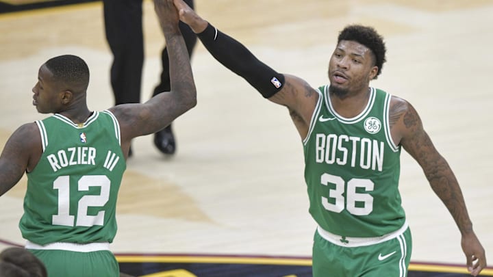 Feb 5, 2019; Cleveland, OH, USA; Boston Celtics guard Terry Rozier (12) and guard Marcus Smart (36) celebrate against the Cleveland Cavaliers in the fourth quarter at Quicken Loans Arena. Mandatory Credit: David Richard-Imagn Images