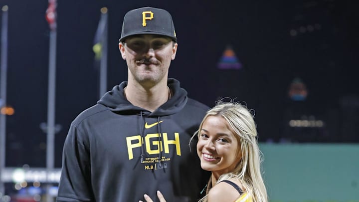 Pittsburgh Pirates starting pitcher Paul Skenes (30) poses with his girlfriend Louisiana State University gymnast Olivia Dunn (right) after making his major league debut against the Chicago Cubs at PNC Park. The Pirates won 10-8 in 2024. Pittsburgh Pirates starting pitcher Paul Skenes (30) poses with his girlfriend Louisiana State University gymnast Olivia Dunn (right) after making his major league debut against the Chicago Cubs at PNC Park. The Pirates won 10-8 in 2024.