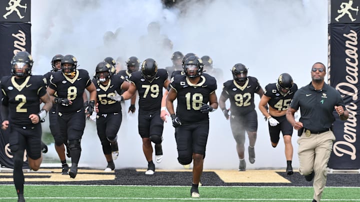 Sep 27, 2025; Winston-Salem, North Carolina, USA;  The Wake Forest Demon Deacons take the field against the Georgia Tech Yellow Jackets at Allegacy Federal Credit Union Stadium. Mandatory Credit: Zachary Taft-Imagn Images