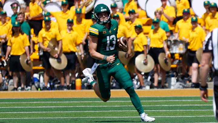 Sep 13, 2025; Waco, Texas, USA;  Baylor Bears quarterback Sawyer Robertson (13) carries the ball for a first down against the Samford Bulldogs during the second half at McLane Stadium. Mandatory Credit: Chris Jones-Imagn Images