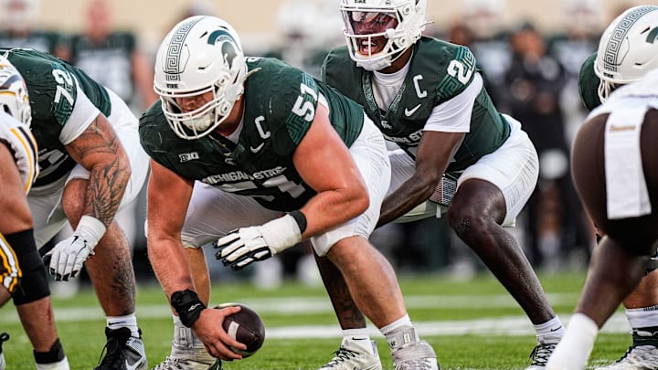 Michigan State quarterback Aidan Chiles (2) calls for a snap from offensive lineman Matt Gulbin (51) against Western Michigan during the first half at Spartan Stadium in East Lansing on Friday, August 29, 2025.