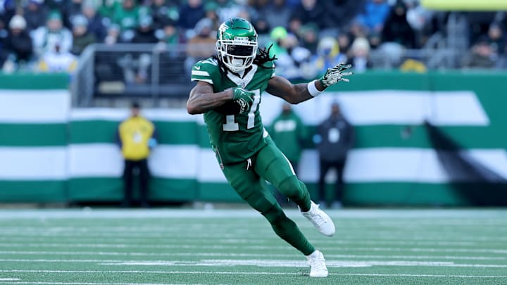 Dec 22, 2024; East Rutherford, New Jersey, USA; New York Jets wide receiver Davante Adams (17) runs with the ball against the Los Angeles Rams during the second quarter at MetLife Stadium. Mandatory Credit: Brad Penner-Imagn Images