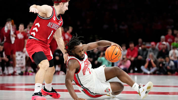 Ohio State Buckeyes guard Bruce Thornton (2) tries to maintain his dribble after colliding with Nebraska Cornhuskers guard Sam Hoiberg (1) during the second half of the NCAA men's basketball game at the Schottenstein Center in Columbus on Jan. 5, 2026. Ohio State lost 72-69. Ohio State Buckeyes guard Bruce Thornton (2) tries to maintain his dribble after colliding with Nebraska Cornhuskers guard Sam Hoiberg (1) during the second half of the NCAA men's basketball game at the Schottenstein Center in Columbus on Jan. 5, 2026. Ohio State lost 72-69.