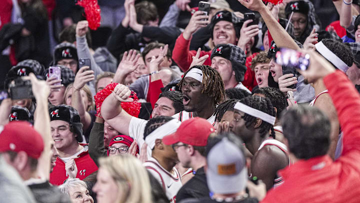 Jan 11, 2025; Athens, Georgia, USA; Georgia Bulldogs center Somto Cyril (center of frame) reacts with the fans after Georgia defeated the Oklahoma Sooners at Stegeman Coliseum. Mandatory Credit: Dale Zanine-Imagn Images
