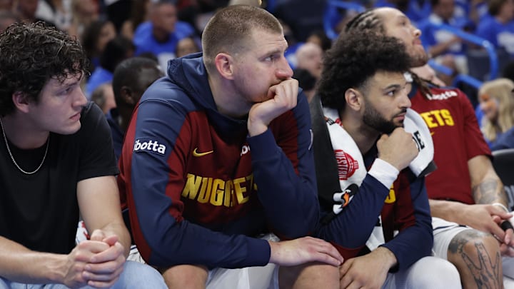 May 18, 2025; Oklahoma City, Oklahoma, USA; Denver Nuggets center Nikola Jokic (15) watches the game from the bench in the fourth quarter against the Oklahoma City Thunder in game seven of the second round for the 2025 NBA Playoffs at Paycom Center. Mandatory Credit: Alonzo Adams-Imagn Images