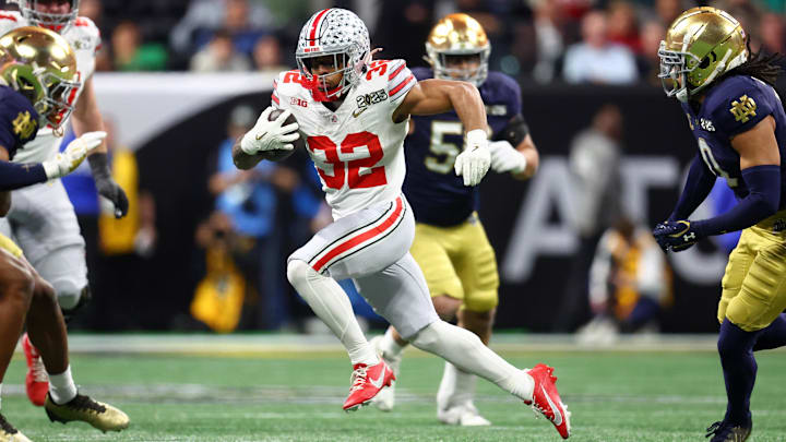 Jan 20, 2025; Atlanta, GA, USA; Ohio State Buckeyes running back TreVeyon Henderson (32) runs with the ball against the Notre Dame Fighting Irish during the first half the CFP National Championship college football game at Mercedes-Benz Stadium. Mandatory Credit: Mark J. Rebilas-Imagn Images Jan 20, 2025; Atlanta, GA, USA; Ohio State Buckeyes running back TreVeyon Henderson (32) runs with the ball against the Notre Dame Fighting Irish during the first half the CFP National Championship college football game at Mercedes-Benz Stadium. Mandatory Credit: Mark J. Rebilas-Imagn Images