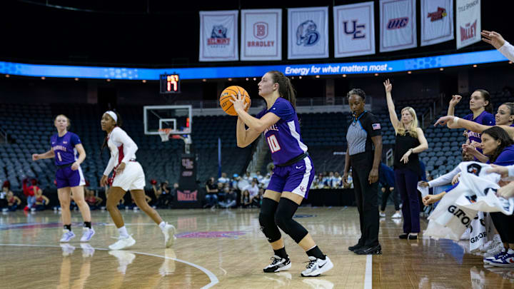 Evansville's Camryn Runner (10) eyes a three-point shot as the University of Evansville Purple Aces play the University of Illinois Chicago during the 2025 Credit Union 1 MVC Women’s Basketball tournament at Ford Center in Evansville, Ind., Thursday, March 13, 2025.