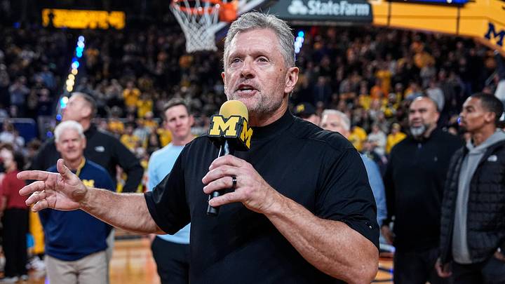 Michigan football head coach Kyle Whittingham speaks as he is being introduced on the floor during the first half between Michigan and USC at Crisler Center in Ann Arbor on Friday, Jan. 2, 2026.