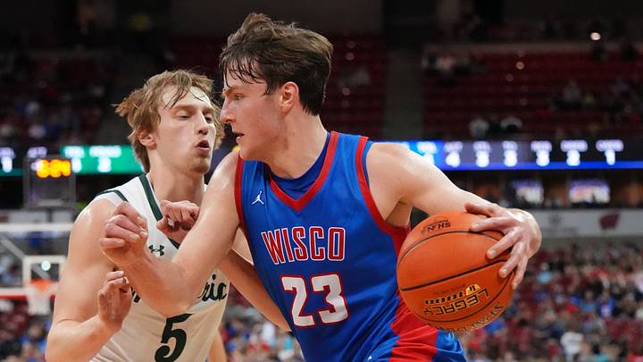 Wisconsin Lutheran's Zavier Zens (23) breaks around Madison Memorial's Cole Slack (5) during the WIAA Division 1 boys state championship basketball game on Saturday, March 21, 2026, at the Kohl Center in Madison, Wisconsin. Wisconsin Lutheran's Zavier Zens (23) breaks around Madison Memorial's Cole Slack (5) during the WIAA Division 1 boys state championship basketball game on Saturday, March 21, 2026, at the Kohl Center in Madison, Wisconsin.