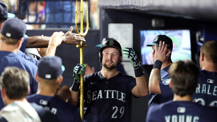 Sep 2, 2025; St. Petersburg, Florida, USA; Seattle Mariners catcher Cal Raleigh (29) is congratulated in the dugout after he hit a home run during the fourth inning against the Tampa Bay Rays at George M. Steinbrenner Field. Mandatory Credit: Kim Klement Neitzel-Imagn Images Sep 2, 2025; St. Petersburg, Florida, USA; Seattle Mariners catcher Cal Raleigh (29) is congratulated in the dugout after he hit a home run during the fourth inning against the Tampa Bay Rays at George M. Steinbrenner Field. Mandatory Credit: Kim Klement Neitzel-Imagn Images